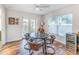 Cozy dining room featuring hardwood floors, a round table with seating for four, and natural light at 1313 E Cayuga St, Tampa, FL 33603