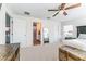 This main bedroom features neutral carpet and paint and an ensuite bathroom at 1313 E Cayuga St, Tampa, FL 33603