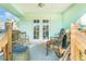 Cozy covered patio with access to the home's interior and offering space for relaxing outdoors at 1313 E Cayuga St, Tampa, FL 33603