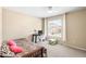 Cozy bedroom features a zebra-print bed, desk, and a bright window with natural light at 14019 Notreville Way, Tampa, FL 33624