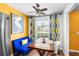 Sunny dining room featuring a cozy banquette and large window at 14019 Notreville Way, Tampa, FL 33624