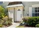 Inviting front entrance with a well-maintained facade and manicured landscaping at 14019 Notreville Way, Tampa, FL 33624