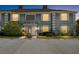 Beautiful townhome featuring an inviting exterior view at dusk at 14019 Notreville Way, Tampa, FL 33624