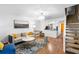 Bright living room featuring stylish decor and hardwood floors, creating a welcoming atmosphere at 14019 Notreville Way, Tampa, FL 33624