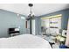Bright main bedroom features stylish decor and a mirrored closet at 14019 Notreville Way, Tampa, FL 33624