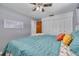 Bright bedroom featuring a ceiling fan, double closet, and gray walls, perfect for relaxation and storage at 1541 68Th N Ave, St Petersburg, FL 33702