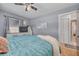 Charming bedroom featuring a comfortable bed, a ceiling fan, and stylish decor for a cozy atmosphere at 1541 68Th N Ave, St Petersburg, FL 33702