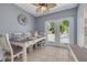 Charming dining area featuring a stylish table, French doors, and a view of the pool at 1541 68Th N Ave, St Petersburg, FL 33702