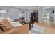 Inviting living room with a comfortable leather sofa, stylish rug, and modern decor accents at 1541 68Th N Ave, St Petersburg, FL 33702