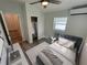 Well-lit bedroom featuring ample storage, a bright window, and a comfortable bed at 1574 Ewing Ave, Clearwater, FL 33756
