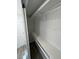 Walk-in closet with a single shelf running the width of the closet at 1574 Ewing Ave, Clearwater, FL 33756