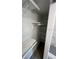 Walk-in closet with multiple shelves running the width of the closet at 1574 Ewing Ave, Clearwater, FL 33756