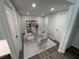 Dining room with a modern table, chairs, and a stylish bookshelf at 1574 Ewing Ave, Clearwater, FL 33756