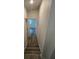 Hallway with hardwood floors leading to a bedroom at 1574 Ewing Ave, Clearwater, FL 33756