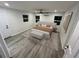 Serene main bedroom with ample natural light, a comfortable bed, and stylish decor at 1574 Ewing Ave, Clearwater, FL 33756