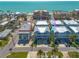 Stunning aerial view of beach condos with turquoise waters and nearby buildings at 16306 1St E St, Redington Beach, FL 33708