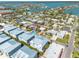 Aerial view of a charming neighborhood showcasing well-maintained homes near a picturesque waterway at 16306 1St E St, Redington Beach, FL 33708