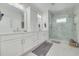 Luxurious bathroom featuring double vanity, modern fixtures, and a spacious glass-enclosed shower at 16306 1St E St, Redington Beach, FL 33708