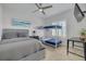 Shared bedroom featuring a full-sized bed, a bunk bed, a desk, and natural light at 16306 1St E St, Redington Beach, FL 33708
