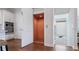 Interior view highlighting a convenient residential elevator off the kitchen on a beautiful hardwood floor at 16306 1St E St, Redington Beach, FL 33708