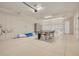 Spacious garage features a ping pong table, kayak, and storage, offering versatile space for recreation and storage at 16306 1St E St, Redington Beach, FL 33708