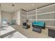 Outdoor patio offers an inviting seating arrangement with wicker furniture and stylish privacy screens, perfect for relaxation at 16306 1St E St, Redington Beach, FL 33708