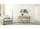 Cozy home office featuring a desk, accent chair, and bright natural light at 17560 Happytrails St, Land O Lakes, FL 34638