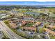 Aerial view of a residential community nestled near golf courses, lakes, and scenic landscapes at 1998 Blue Hawk Ct # 1613, Clearwater, FL 33762