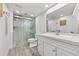 Stylish bathroom featuring modern vanity, a glass-enclosed shower, and sleek fixtures at 1998 Blue Hawk Ct # 1613, Clearwater, FL 33762