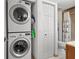 Convenient stacked washer and dryer in a dedicated space by the bathroom at 1998 Blue Hawk Ct # 1613, Clearwater, FL 33762