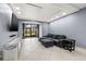 Modern living room features tiled floors, recessed lighting and a large glass window overlooking the garden at 1998 Blue Hawk Ct # 1613, Clearwater, FL 33762