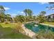 Scenic pond and landscaped common grounds at 1998 Blue Hawk Ct # 1613, Clearwater, FL 33762
