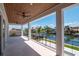 Expansive balcony with tongue and groove ceiling, large white columns and beautiful water view at 2050 Hawaii Ne Ave, St Petersburg, FL 33703