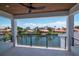 Covered balcony provides stunning water view in a lush community; modern ceiling fan and trim detailing included at 2050 Hawaii Ne Ave, St Petersburg, FL 33703