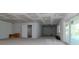 Unfinished basement with drywall ceiling and walls with sliding glass doors to the exterior at 2050 Hawaii Ne Ave, St Petersburg, FL 33703
