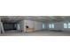 Large unfinished basement with natural lighting, construction materials and equipment at 2050 Hawaii Ne Ave, St Petersburg, FL 33703