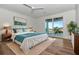 Bright bedroom featuring a king size bed and sliding glass doors to a balcony at 2050 Hawaii Ne Ave, St Petersburg, FL 33703