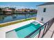 Elevated view of backyard pool, spa, and canal front setting at 2050 Hawaii Ne Ave, St Petersburg, FL 33703