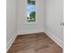Small room with hardwood floors, white walls, a window, and white trim at 2050 Hawaii Ne Ave, St Petersburg, FL 33703