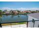 Scenic view from the balcony shows a waterway, enhancing the property's appeal, under a clear, sunny sky at 2050 Hawaii Ne Ave, St Petersburg, FL 33703