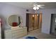 Bedroom featuring a dresser with mirror and built in closet at 2284 Philippine Dr # 41, Clearwater, FL 33763