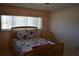 Bedroom features a comfortable bed with floral bedding at 2284 Philippine Dr # 41, Clearwater, FL 33763