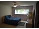A bedroom with a ceiling fan and a sunny window provides a relaxing space at 2284 Philippine Dr # 41, Clearwater, FL 33763