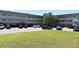 Exterior view of condo building, with a lawn in front and a parking area at 2284 Philippine Dr # 41, Clearwater, FL 33763