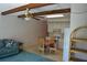 Cozy living room with ceiling fan, wood beams, kitchen, and dining area at 2284 Philippine Dr # 41, Clearwater, FL 33763