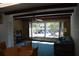 Bright living room featuring wood beams, large window, and comfortable seating at 2284 Philippine Dr # 41, Clearwater, FL 33763
