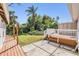 Lush backyard with a wooden deck, perfect for outdoor entertaining and relaxation at 2414 W State St, Tampa, FL 33609