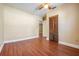 Bedroom with ceiling fan, wood floors, and closet at 2414 W State St, Tampa, FL 33609