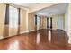 Inviting living room with hardwood floors and natural light from large windows at 2414 W State St, Tampa, FL 33609