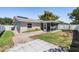 View of the backyard with a patio and screened-in porch at 2755 Merlin Way, Clearwater, FL 33761